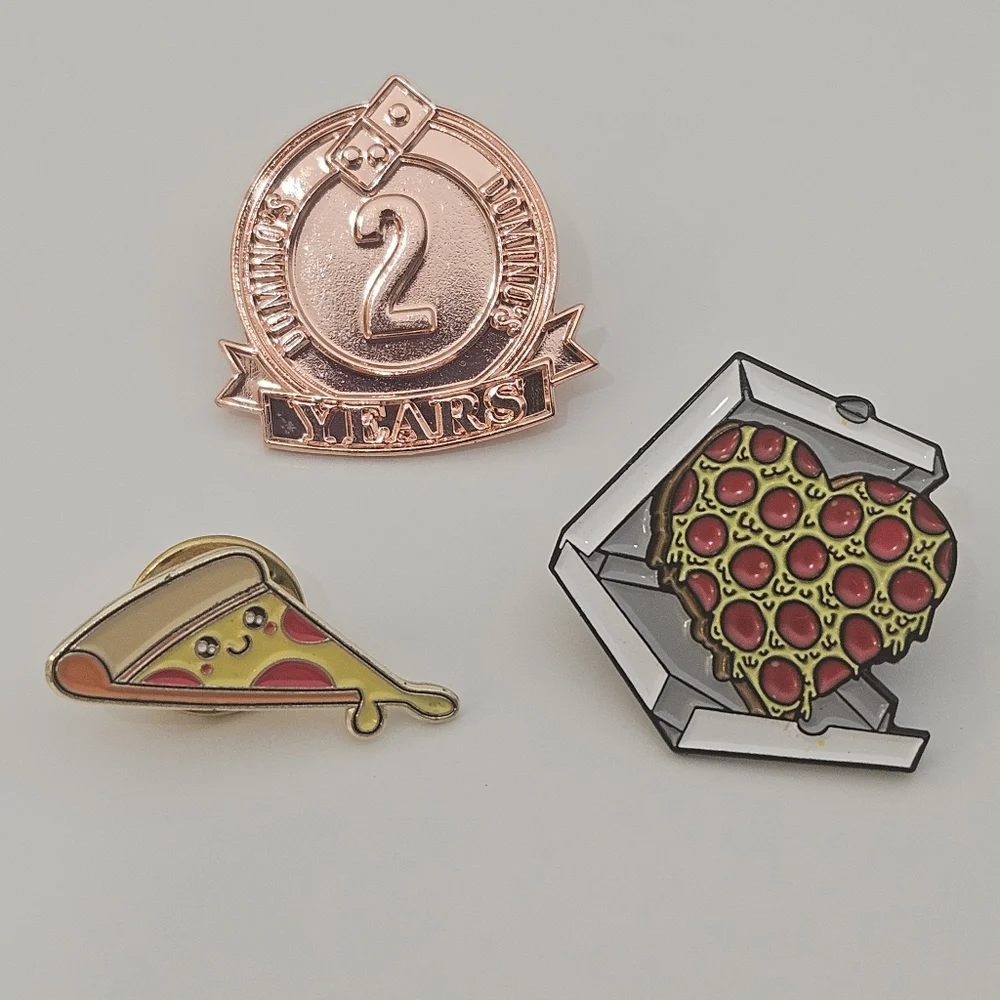 Domino's pizza pins, happy face pizza, heart-shaped pizza in box,and 2 yos pin